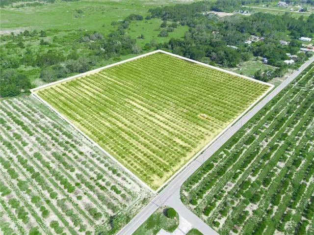 a view of a balcony with a yard