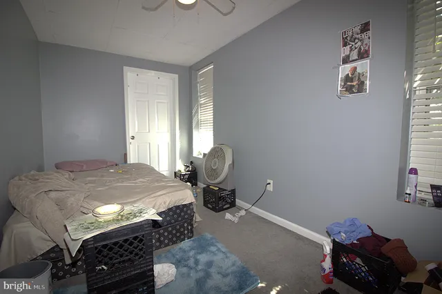 a bedroom with bed and window