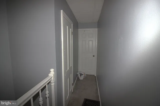 a bathroom with a sink a toilet and a window