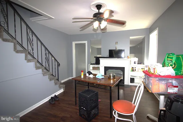 a kitchen with white cabinets and appliances