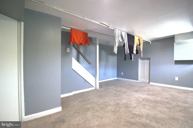 a view of a hallway with stairs