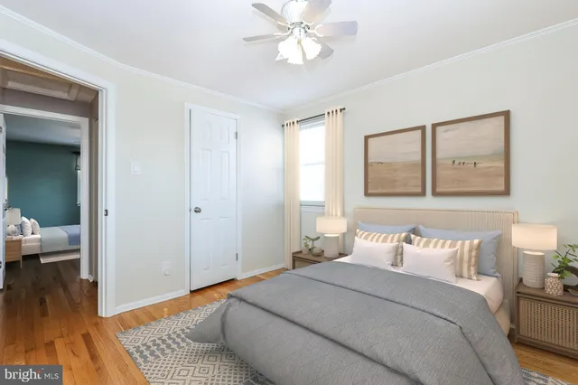 a bedroom with a bed and a mirror