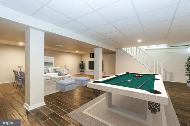 a bathroom with a granite countertop sink a mirror a vanity and a bathtub