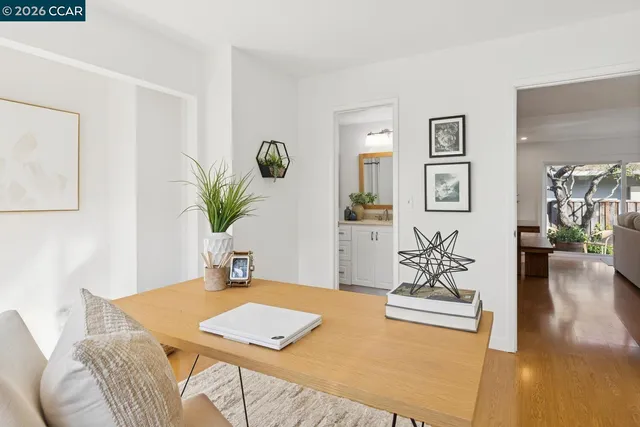 a bathroom with a toilet a sink and a window
