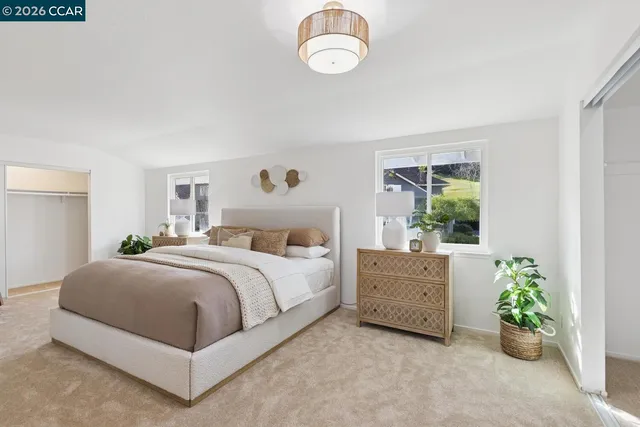 a bedroom with a bed and window