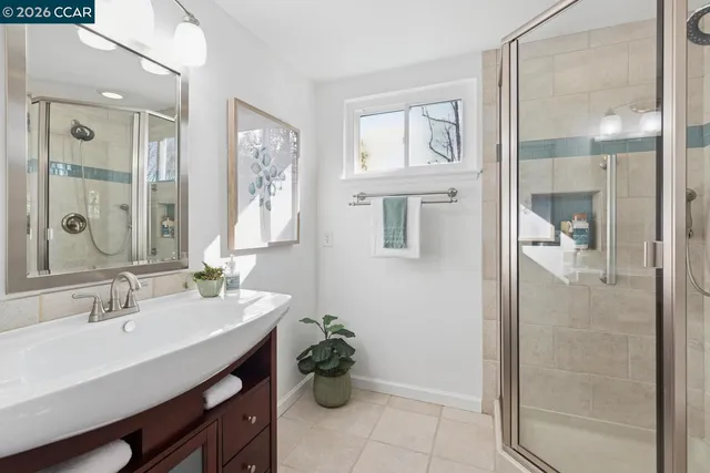 a view of a chair and table in backyard of the house