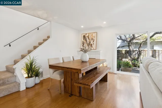 a view of a room with furniture and window