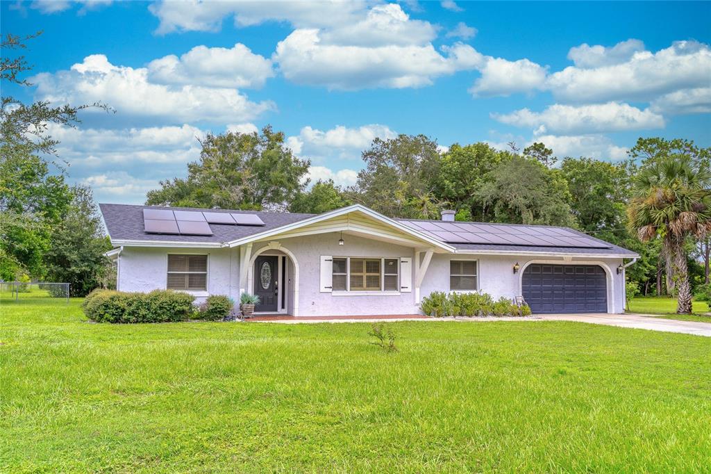 1200 Adams Street Longwood, FL 32750 - Photo 1 of 1 a front view of house with yard and green space