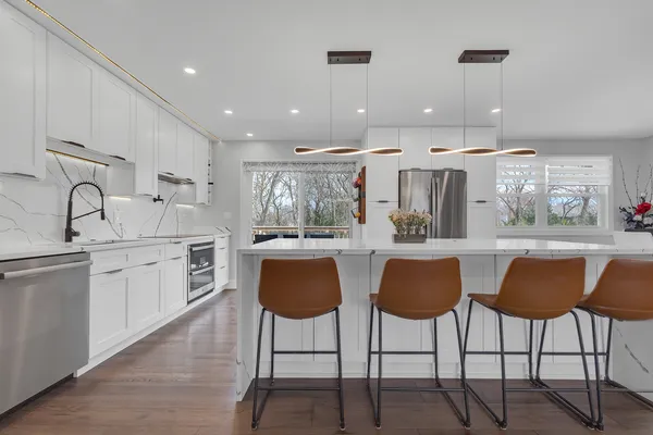a kitchen with granite countertop a counter top space appliances and cabinets