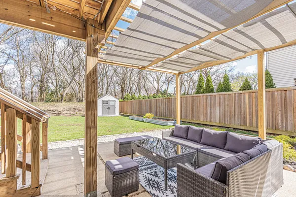 a balcony view with a seating space
