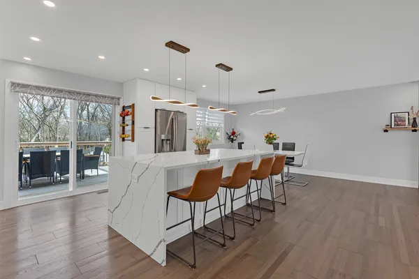 a view of a dining room with furniture window and wooden floor