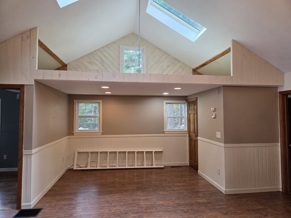 659 Reservoir Road Lunenburg, MA 01462 - Photo 12 of 41 a view of an empty room with a window and wooden floor
