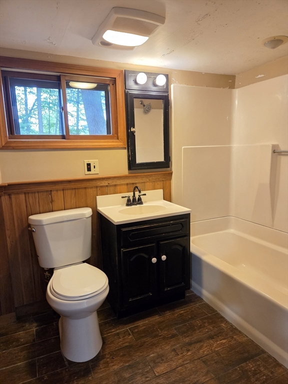 659 Reservoir Road Lunenburg, MA 01462 - Photo 14 of 41 a bathroom with a sink and a mirror