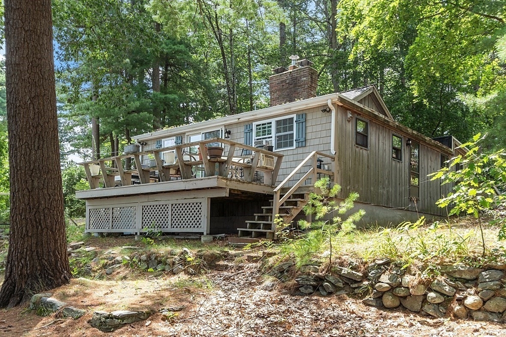 659 Reservoir Road Lunenburg, MA 01462 - Photo 23 of 41 a view of a house with a yard and wooden fence