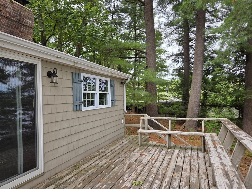 659 Reservoir Road Lunenburg, MA 01462 - Photo 24 of 41 a view of deck with chairs and wooden fence