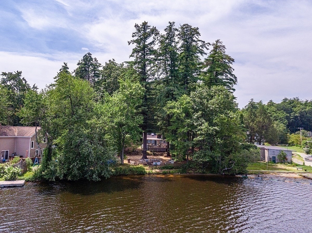 659 Reservoir Road Lunenburg, MA 01462 - Photo 33 of 41 a swimming pool with trees in the background