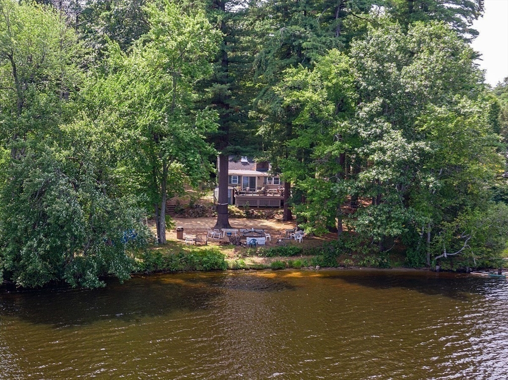 659 Reservoir Road Lunenburg, MA 01462 - Photo 34 of 41 a view of a lake with a house in the background