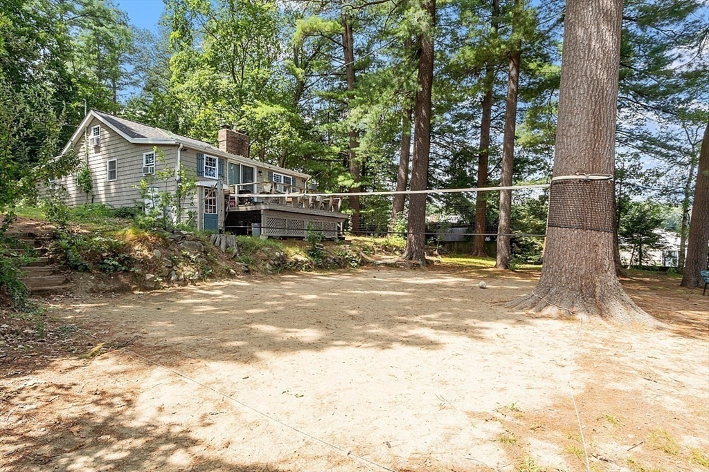 659 Reservoir Road Lunenburg, MA 01462 - Photo 39 of 41 a view of a house with backyard and trees