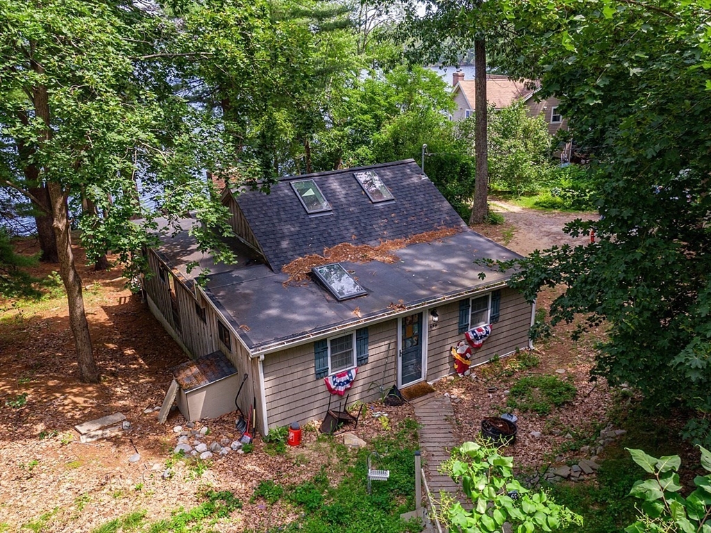 659 Reservoir Road Lunenburg, MA 01462 - Photo 4 of 41 a front view of a house with garden