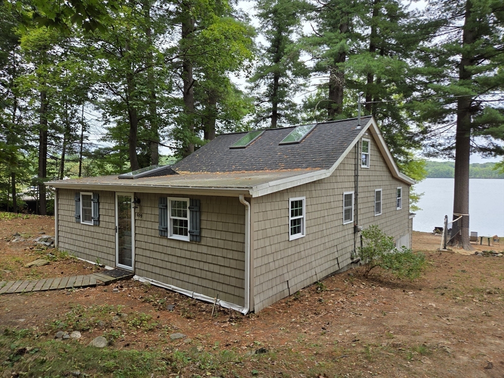 659 Reservoir Road Lunenburg, MA 01462 - Photo 5 of 41 a view of a house with a yard