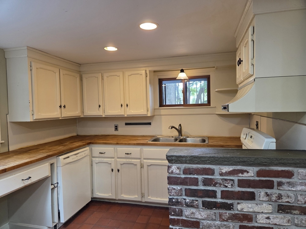 659 Reservoir Road Lunenburg, MA 01462 - Photo 7 of 41 a kitchen with stainless steel appliances granite countertop a sink and cabinets