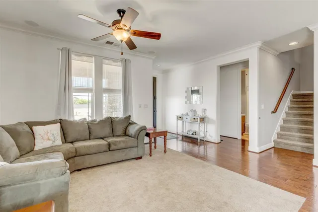 a spacious bedroom with a bed and a dresser