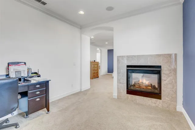 a bedroom with a bed and a fireplace