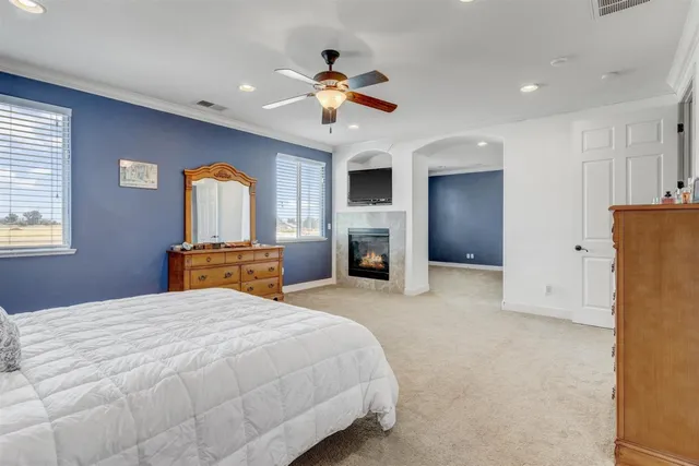 a bedroom with a bed and a fireplace