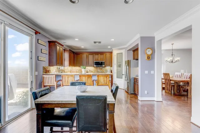 a view of kitchen with cabinets and wooden floor