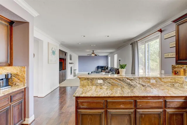 a view of living room with granite countertop furniture and fireplace