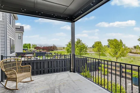 a view of a balcony with furniture