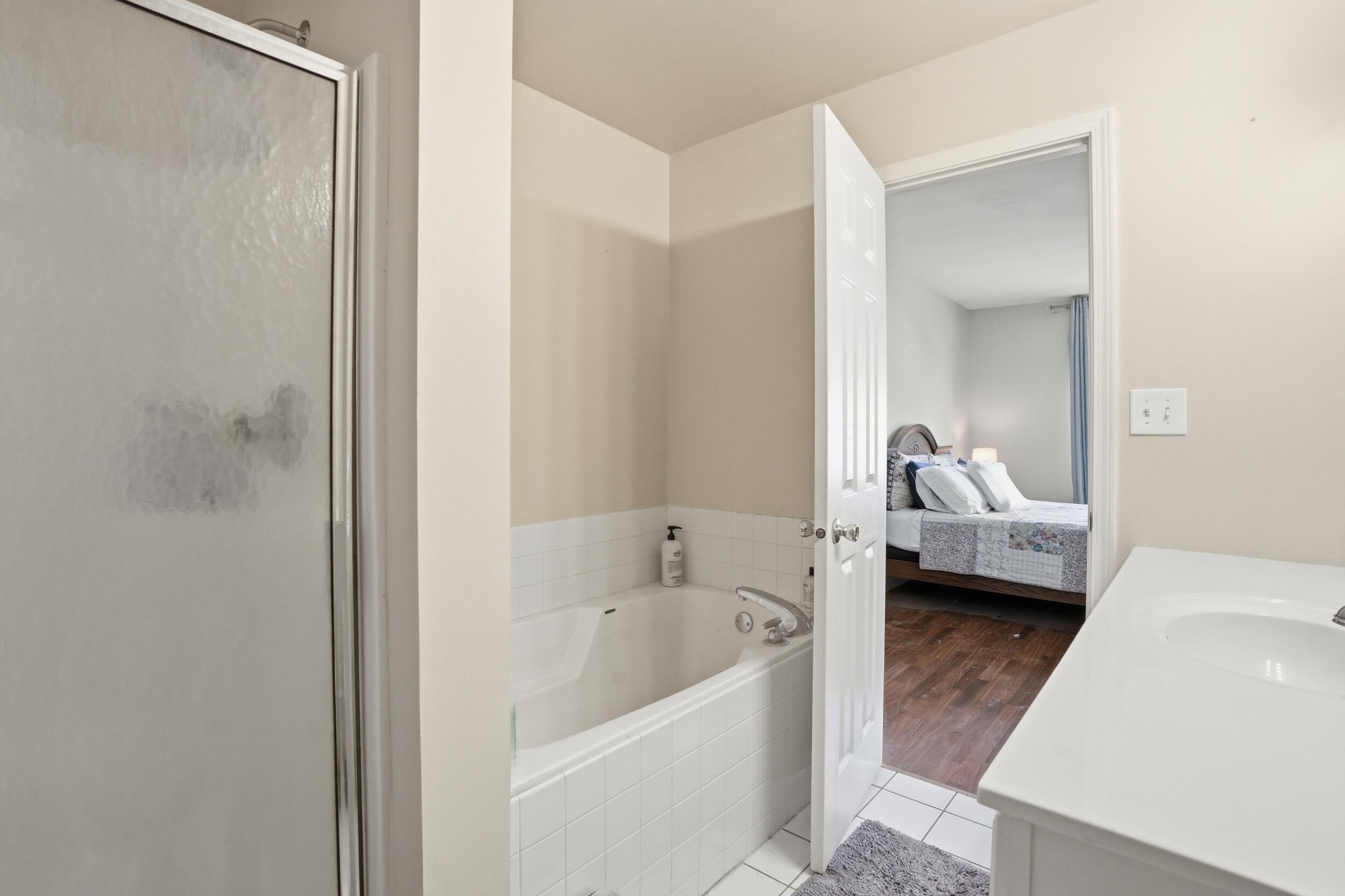 2184 Timberidge Lane Highland, IN 46322 - Photo 16 of 18 a en suite bathroom with a tub sink and mirror