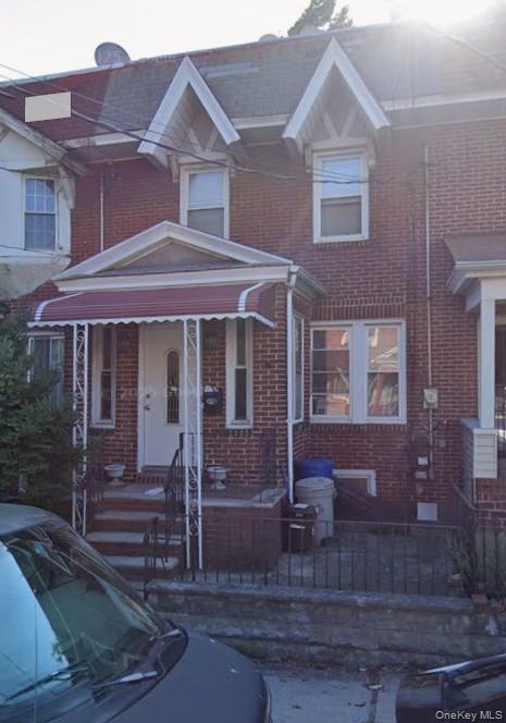 93-06 95th Street Queens, NY 11421 - Photo 1 of 1 a front view of a house with garden
