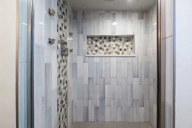 a bedroom with a bed and a television