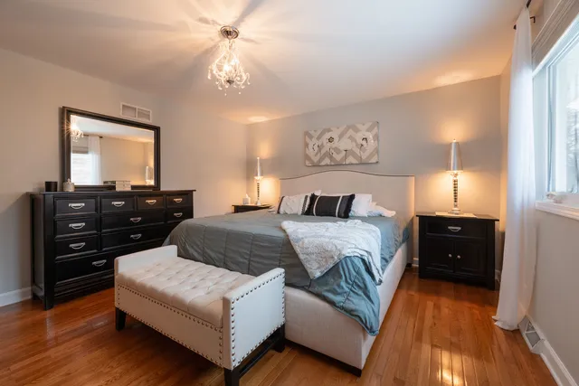 a bedroom with a bed and a dresser