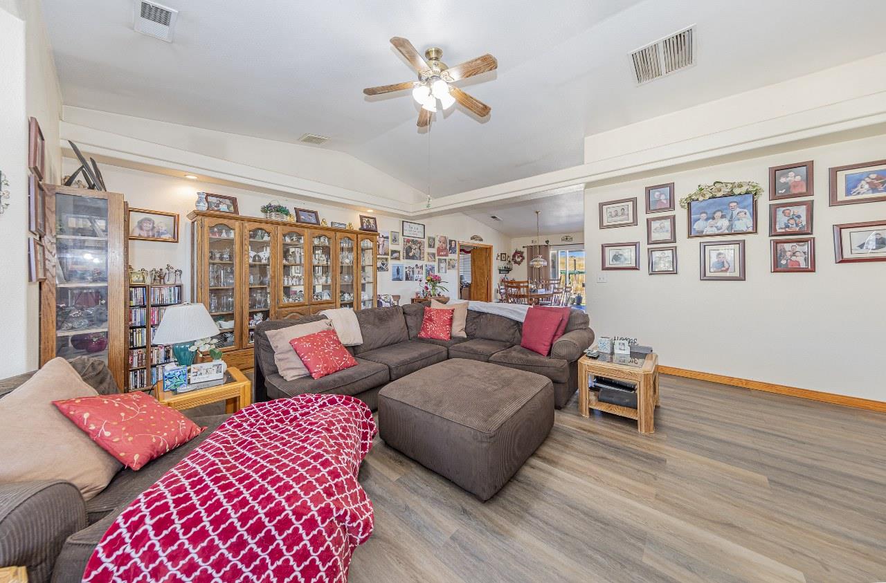 35095 Rough Rider Way Raymond, CA 93653 - Photo 11 of 57 a living room with furniture and wooden floor