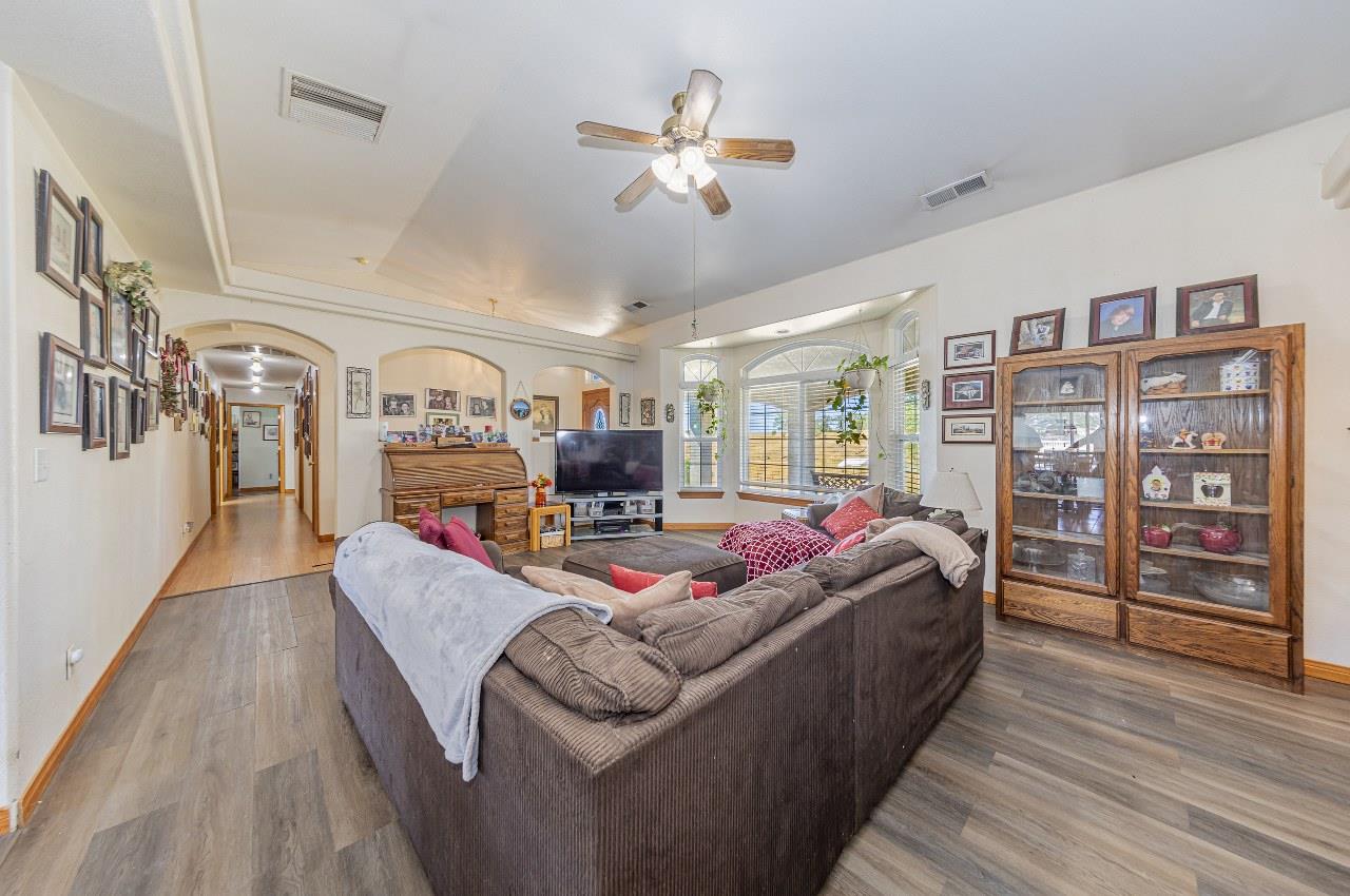 35095 Rough Rider Way Raymond, CA 93653 - Photo 12 of 57 a living room with furniture and wooden floor