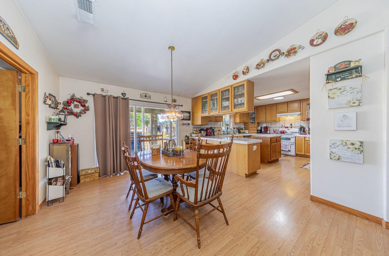 35095 Rough Rider Way Raymond, CA 93653 - Photo 14 of 57 a dining room with furniture and window