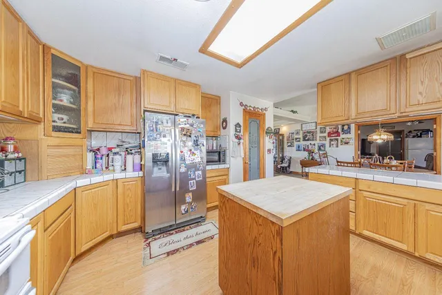 a kitchen with stainless steel appliances a refrigerator and a stove