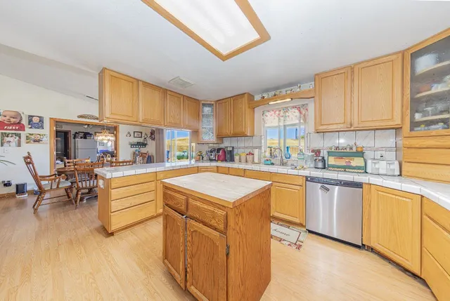 a kitchen with a refrigerator and a sink