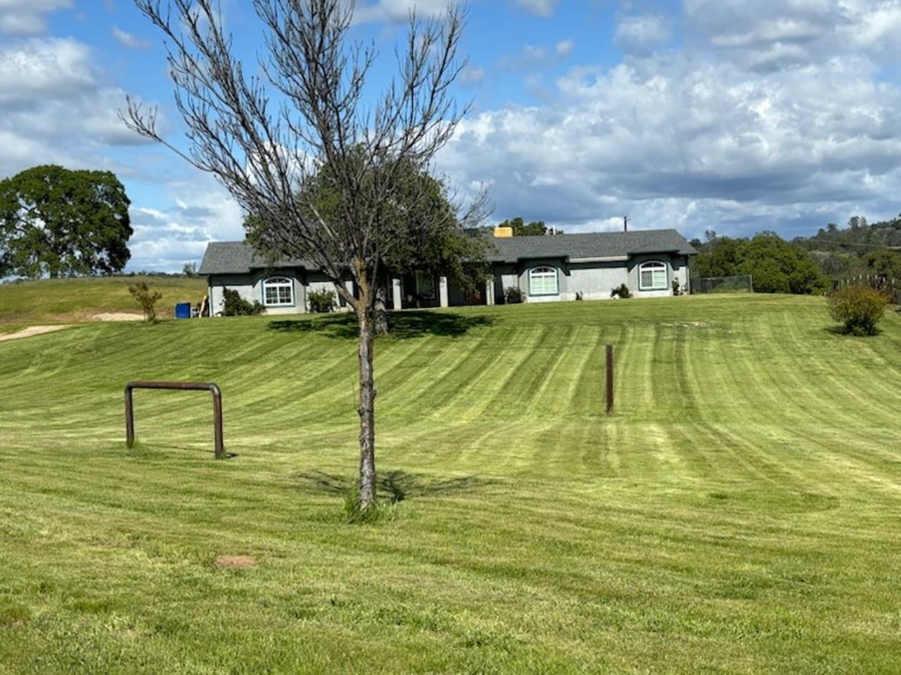 35095 Rough Rider Way Raymond, CA 93653 - Photo 2 of 57 a view of a swimming pool with an outdoor space