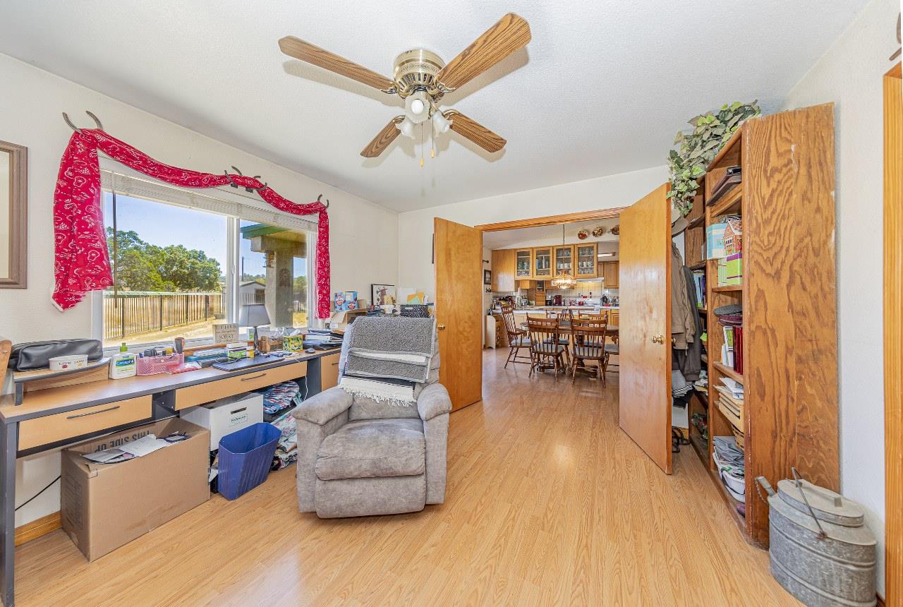 35095 Rough Rider Way Raymond, CA 93653 - Photo 23 of 57 a living room with furniture and a wooden floor