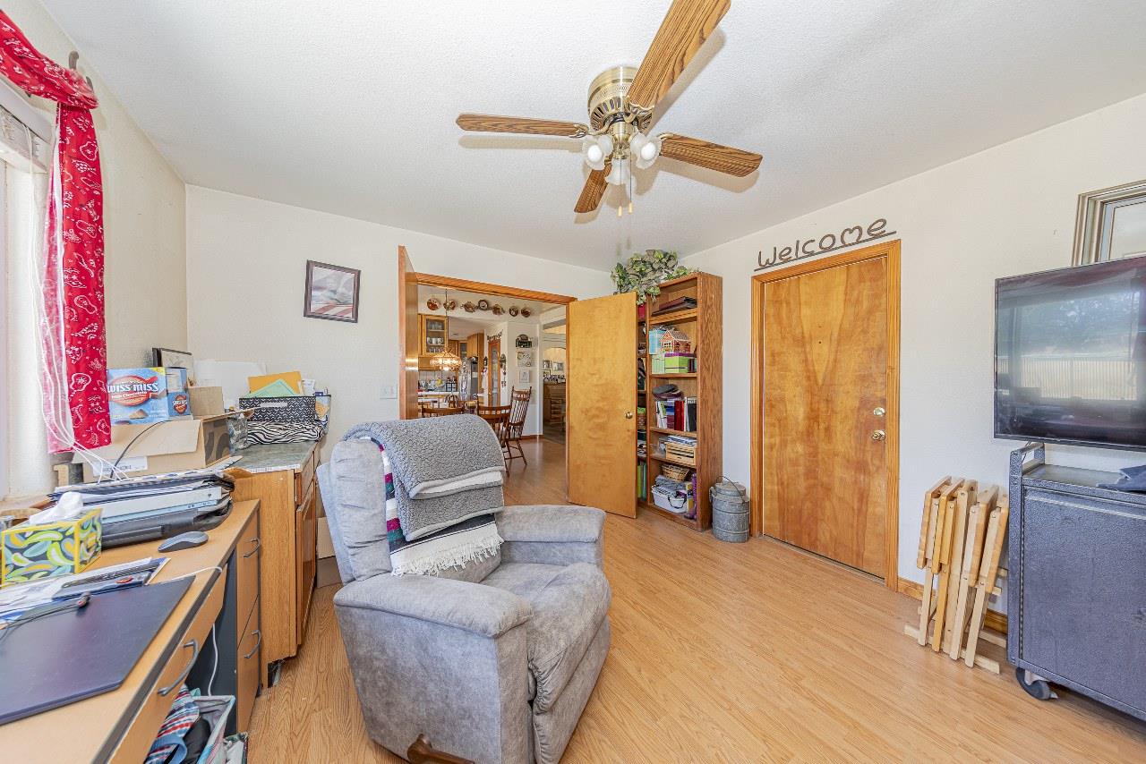 35095 Rough Rider Way Raymond, CA 93653 - Photo 24 of 57 a living room with furniture and a flat screen tv