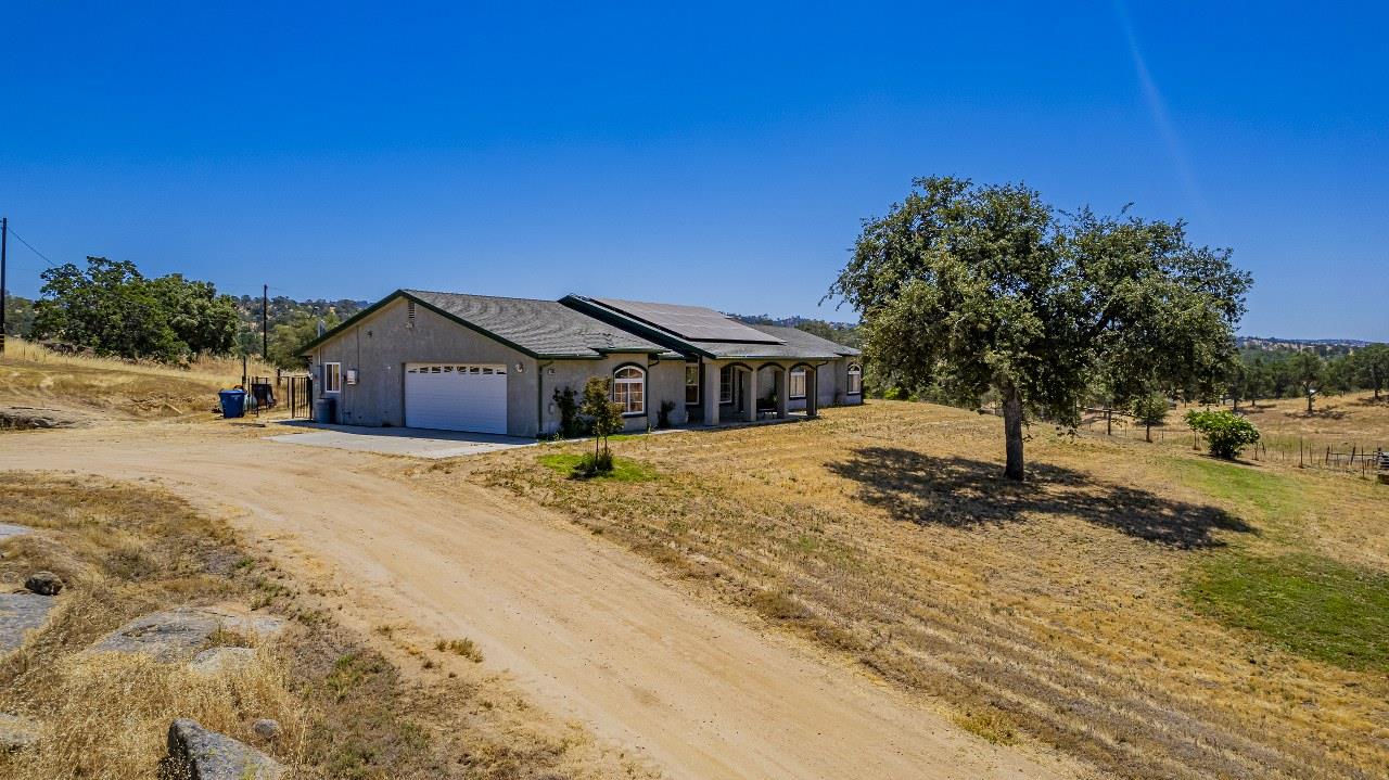 35095 Rough Rider Way Raymond, CA 93653 - Photo 47 of 57 a front view of a house with a yard