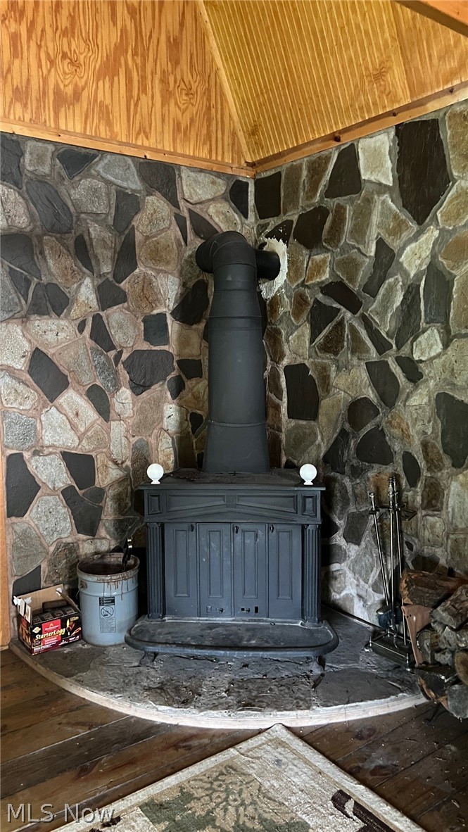 5017 Jade Road Northwest Carrollton, OH 44615 - Photo 10 of 22 Woodburning stove warms up the home in the winter.