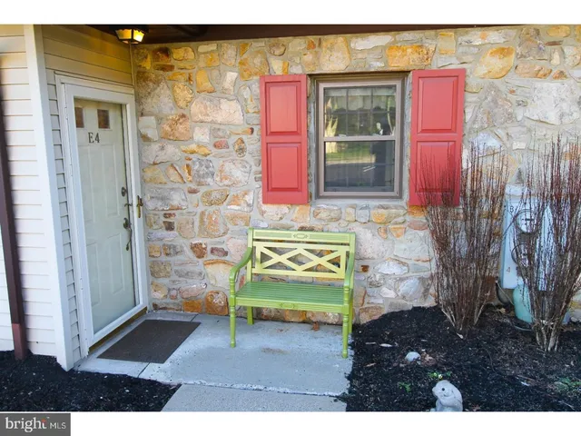 a kitchen with a refrigerator and a sink