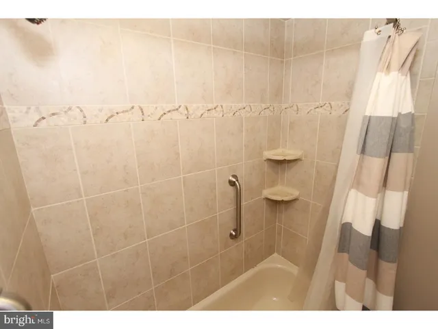 a view of a patio with table and chairs and potted plants