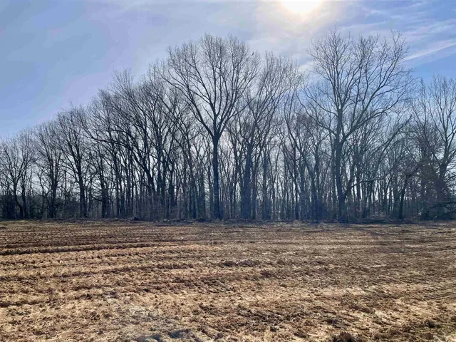 a front view of house with a fence