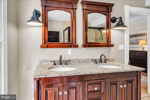a living room with furniture a flat screen tv and a window