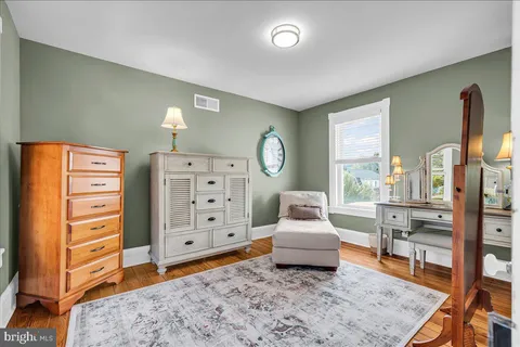 a bathroom with a sink a mirror and window